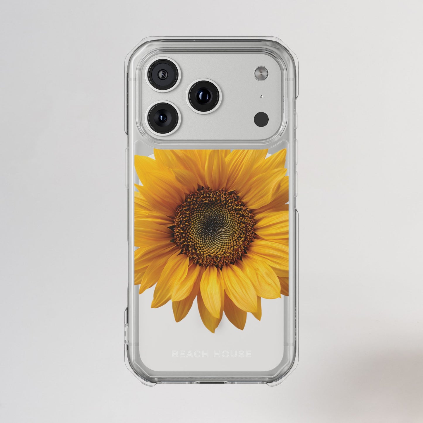 Phone case with a sunflower design on a light gray background