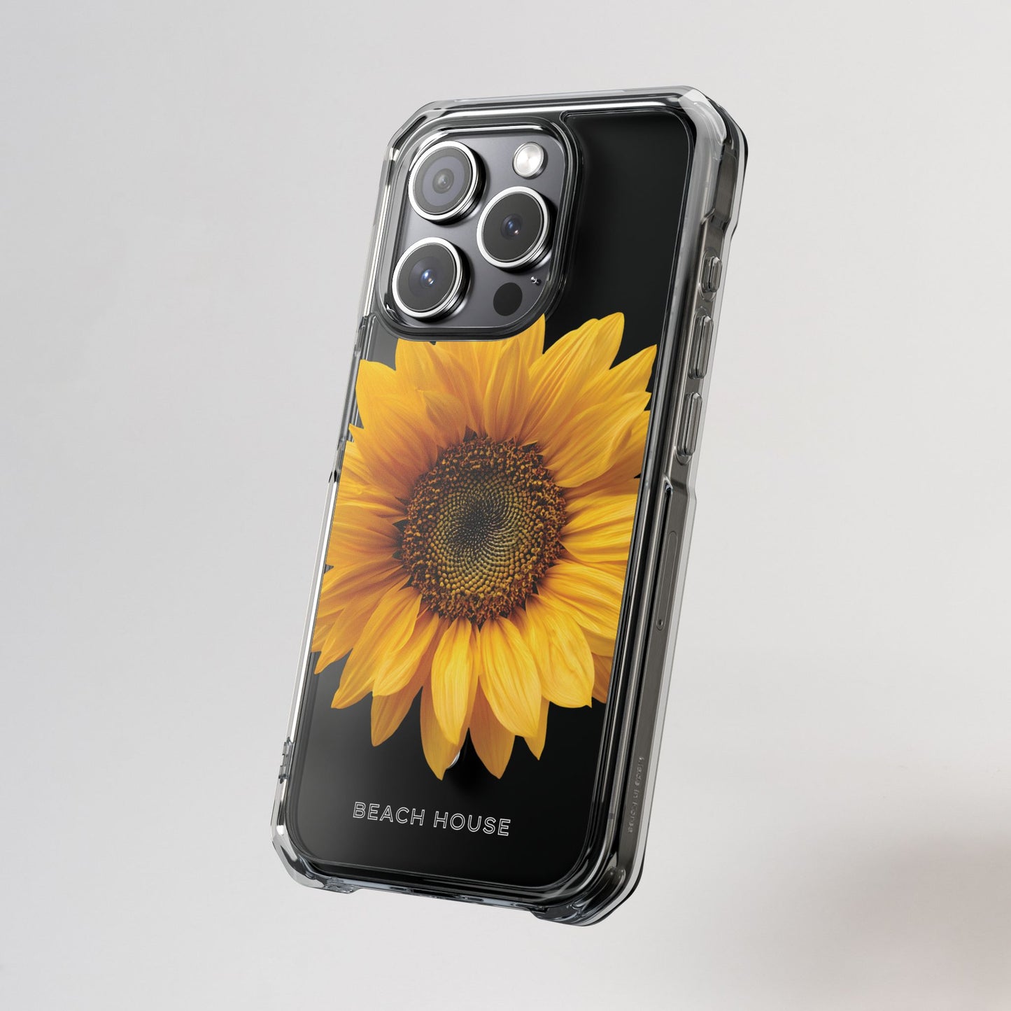 Phone case with a sunflower design on a gray background