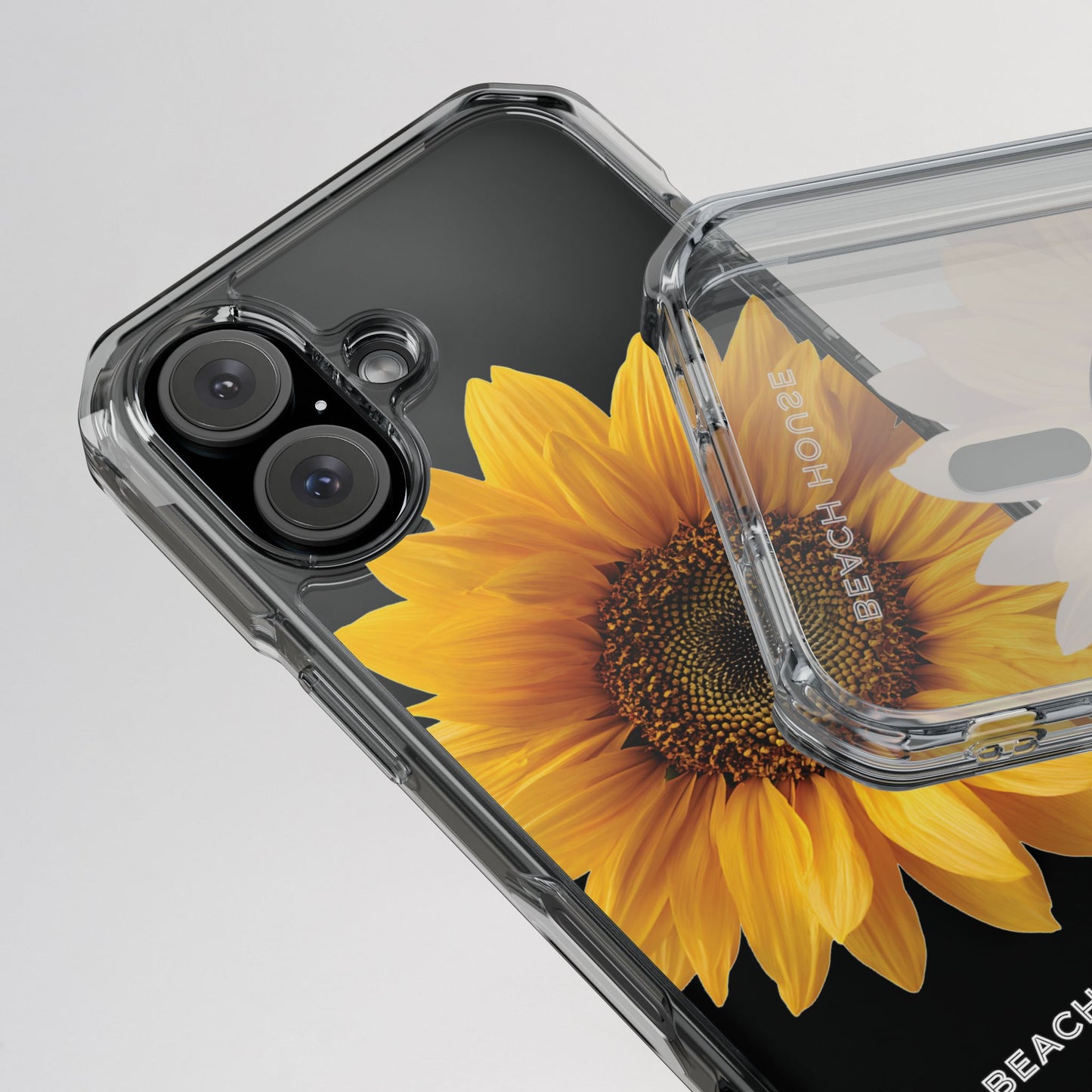 Phone case with sunflower design and 'Bench Home' branding on a gray background