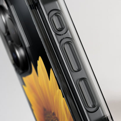 Close-up of a phone case with a sunflower design on a gray background
