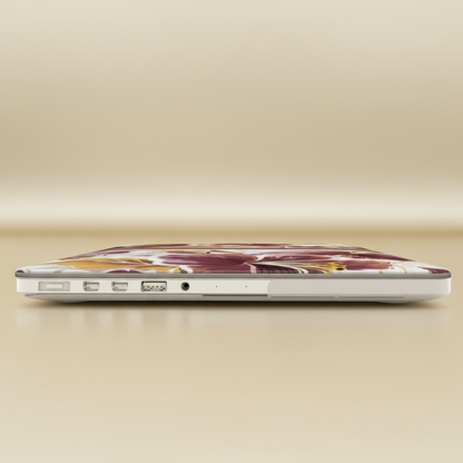 Laptop with a Tallahassee MacBook Case on a beige background