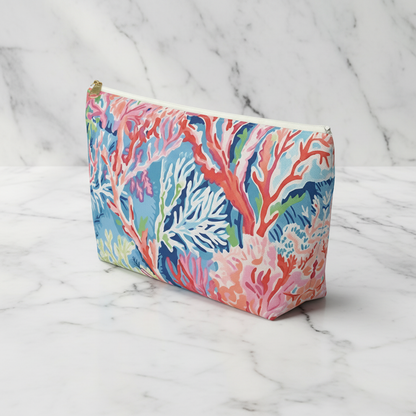 Colorful coral-themed pouch on a marble background