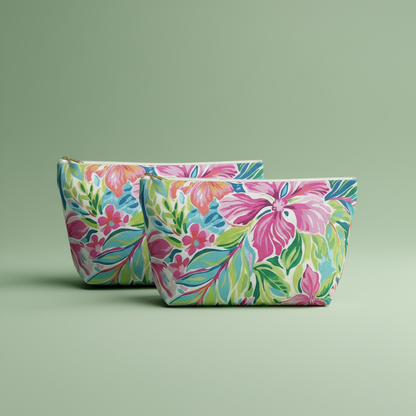 Two floral-patterned pouches on a green background