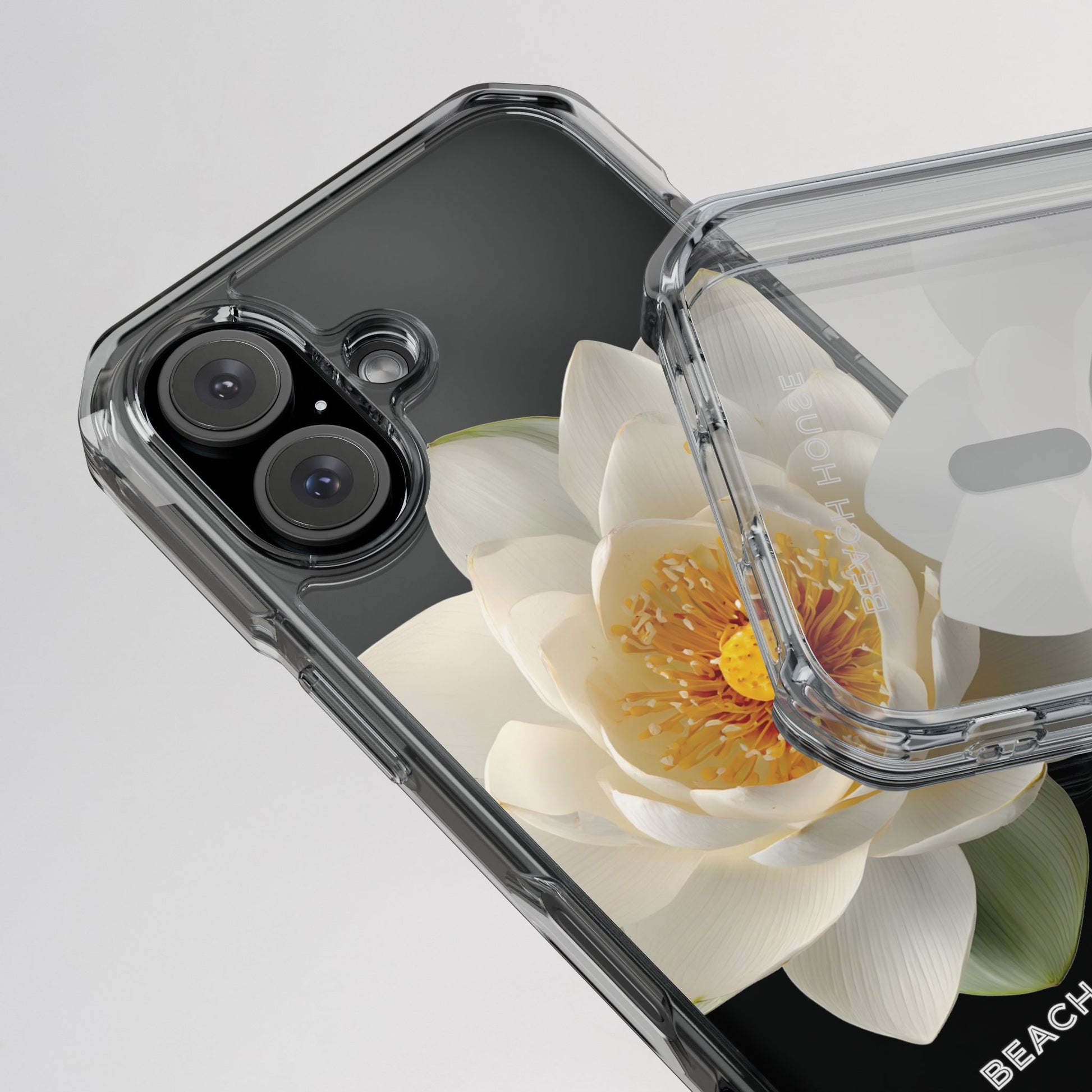 Phone case with a white flower design on a gray background