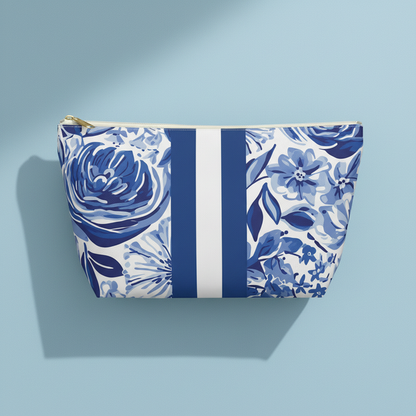 Blue floral patterned pouch with white stripe on a light blue background